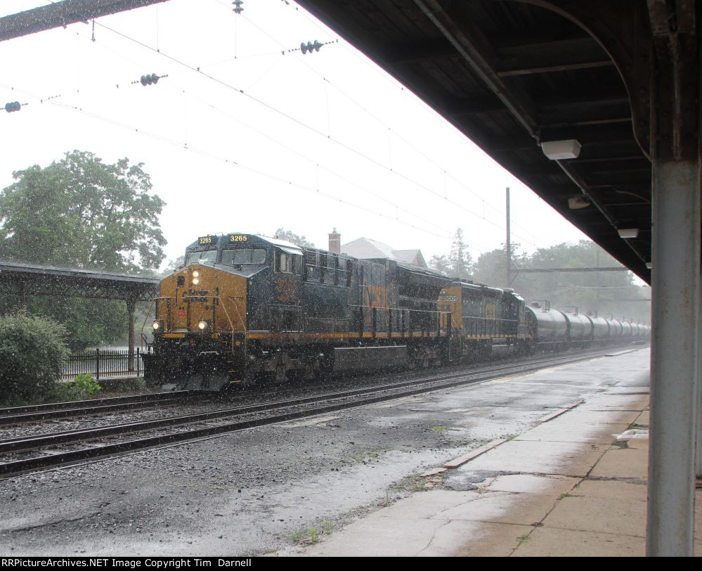 CSX 3265 leads M404 in pouring rain